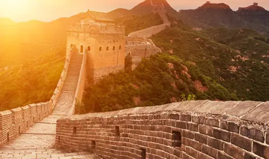 Sun setting over Great Wall of China